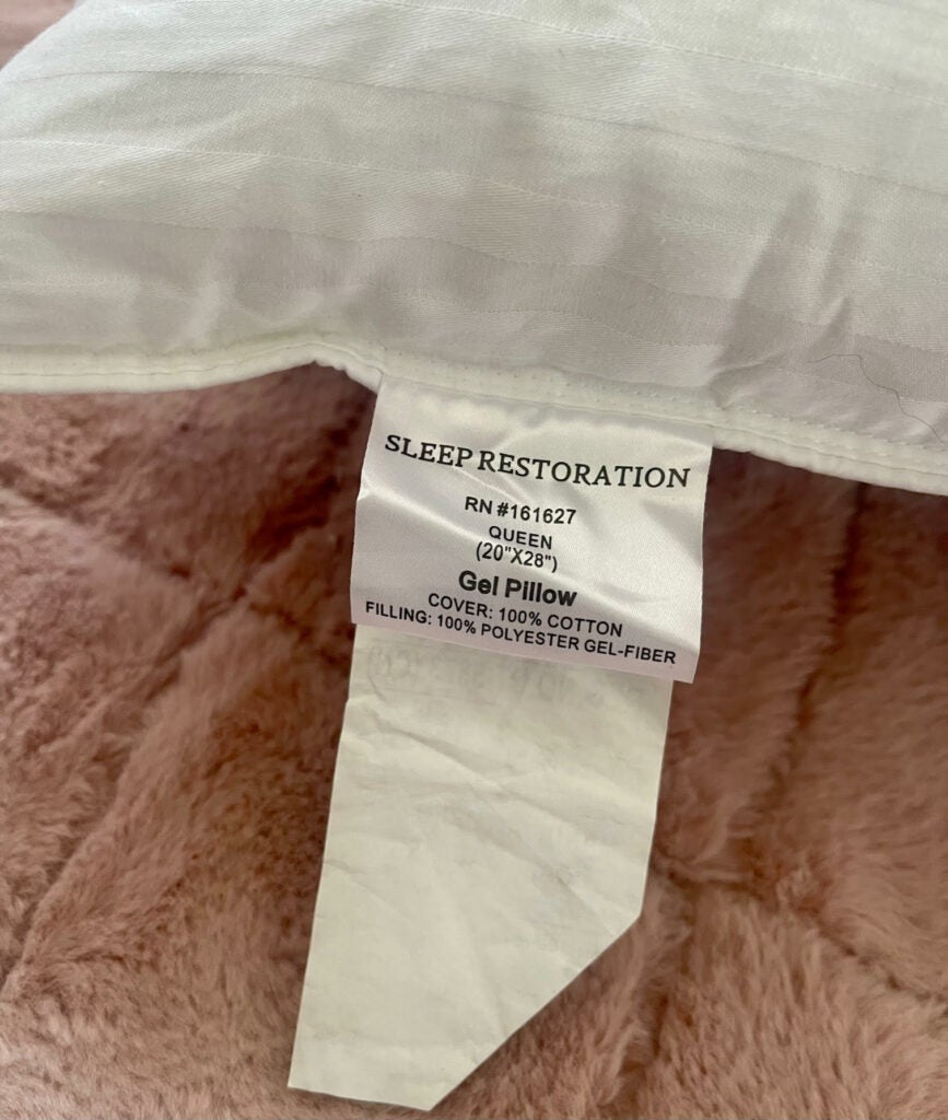 Sleep Restoration pillow tag indicating washing instructions
