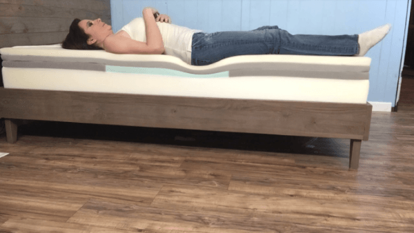 woman sleeping on her back on a casper mattress