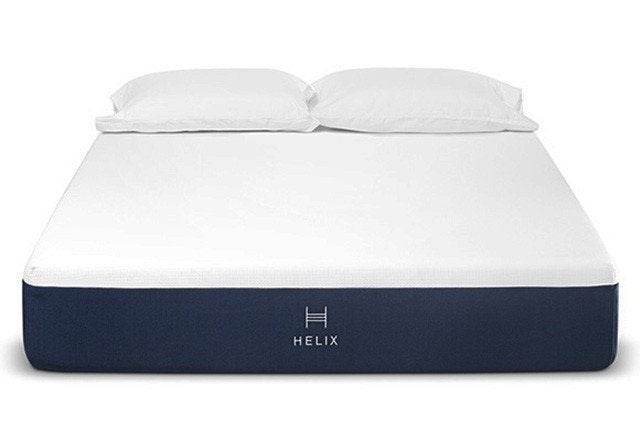 helix mattress, purple bottom and plush pillow top with two pillows on it