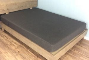 Casper Essential mattress - on a wooden bed-frame which a black mattress and wood hardwood floors