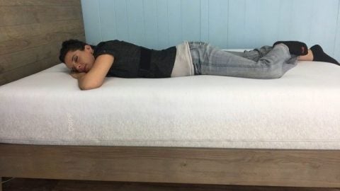 Jess sleeping on her stomach on a casper wave mattress